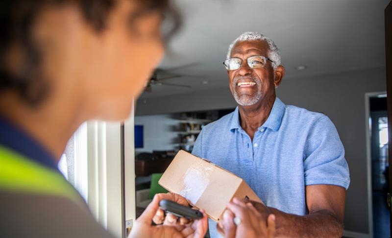 Man recieving pharmacy package