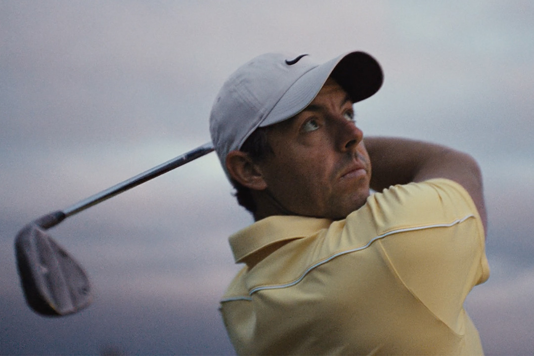 Rory McIlroy watching a golf ball travel