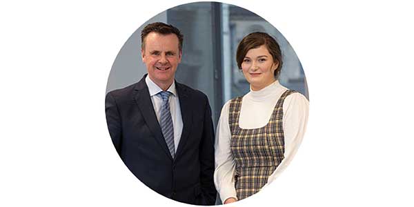 Padraig Monaghan, CEO of Optum Ireland with Scholar Sophie Carlin at Ulster University ceremony