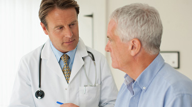 Doctor speaking to patient